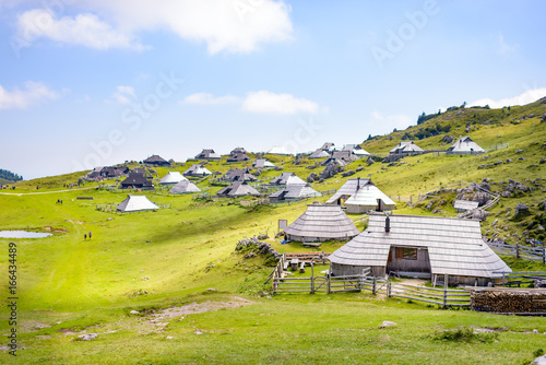 Velika planina plateau, Slovenia, Mountain village in Alps, wooden houses in traditional style, popular hiking destination photo