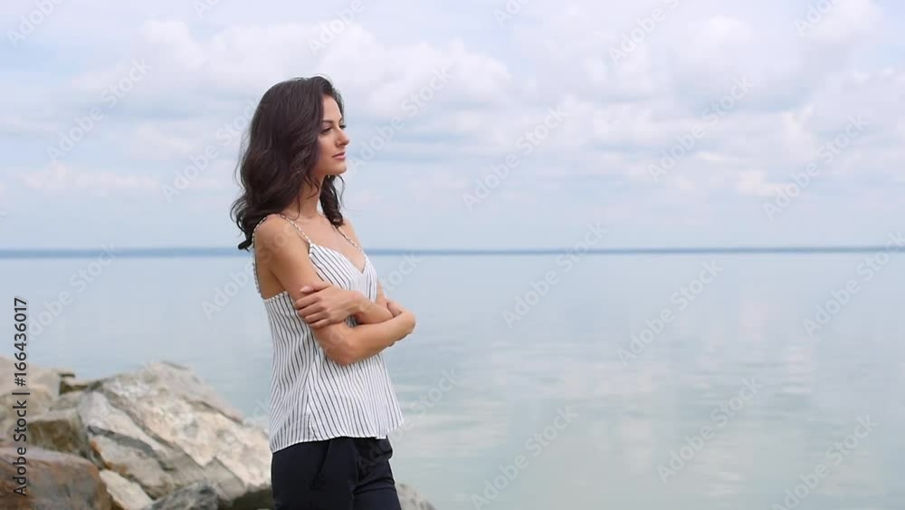 Beautiful girl posing for a photographer. Slowmotion