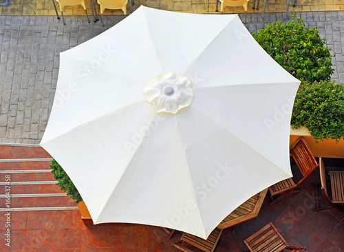 White umbrella on the terrace photo