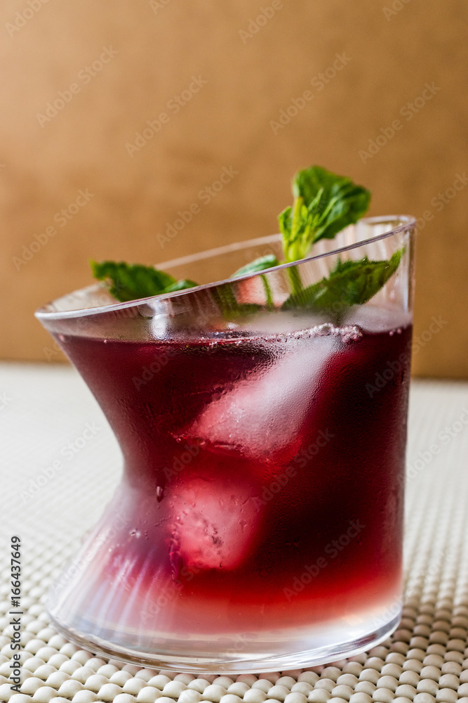 Malibu Sunset Cocktail with mint leaves.. Malibu Sunset Cocktail with mint leaves..