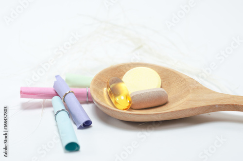 Pharmaceutical medicament, cure in container for health. Pharmacy theme, Heap of white yellow white round capsule pills with medicine antibiotic in packages. 