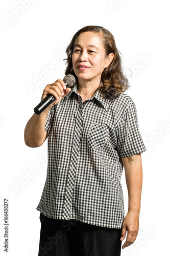 Portrait of a senior asian women sing a song into microphone. Isolated on white background with clipping path