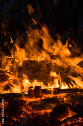 burning wood closeup in real; firereal fire flame render, bonfire campfire\ camp fire hot orange flame. 