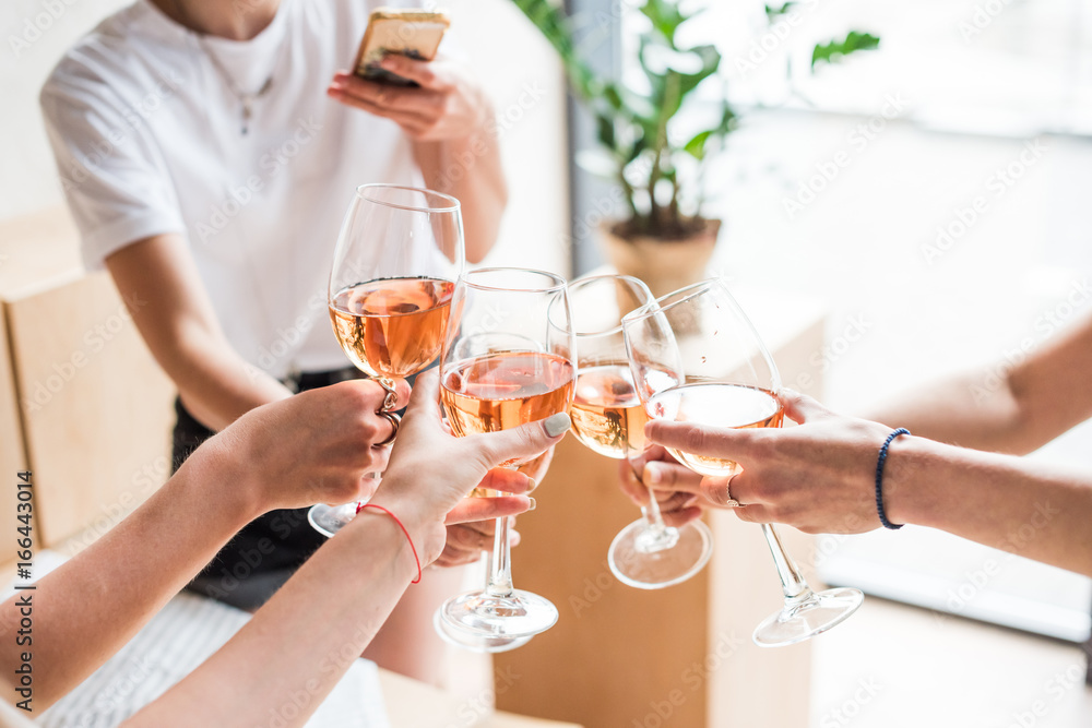 women clinking with wineglasses women clinking with wineglasses