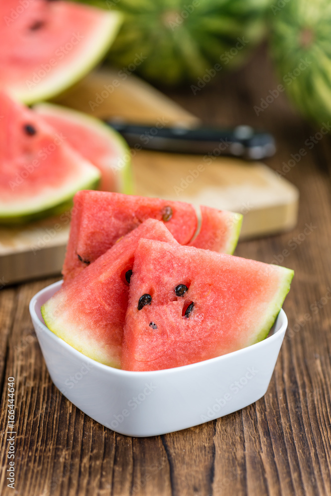 Portion of Fresh Watermelon on wooden background (selective focus). Portion of Fresh Watermelon on wooden background (selective focus).