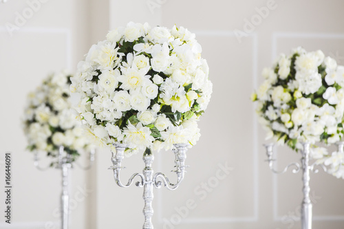 elegant wedding reception table arrangement, floral centerpiece photo
