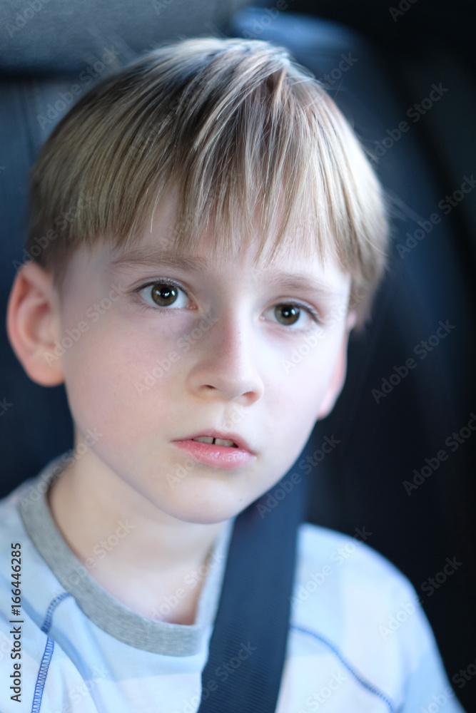 Portrait of a boy sitting in the car Portrait of a boy sitting in the car