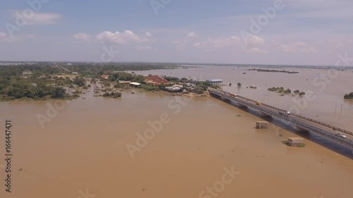 Wallpaper Mural flying towards a concrete bridge running across the flooded river in urban area Torontodigital.ca