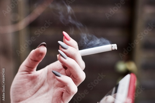 Cigarette in woman hand