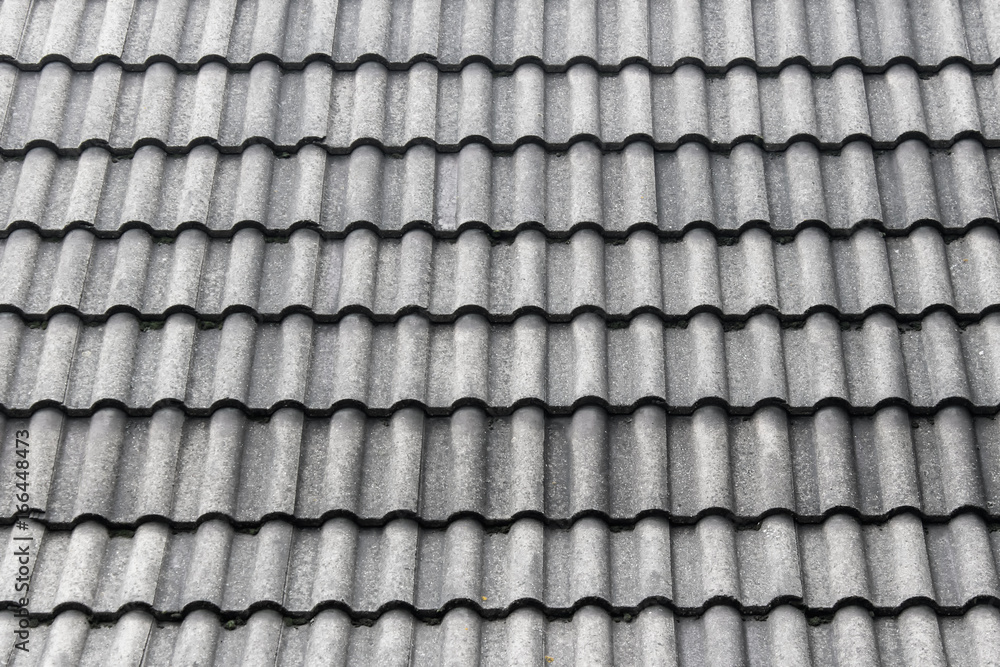Texture with gray roof tiles. Roof protecting cover material arranged in rows. Texture with gray roof tiles. Roof protecting cover material arranged in rows.