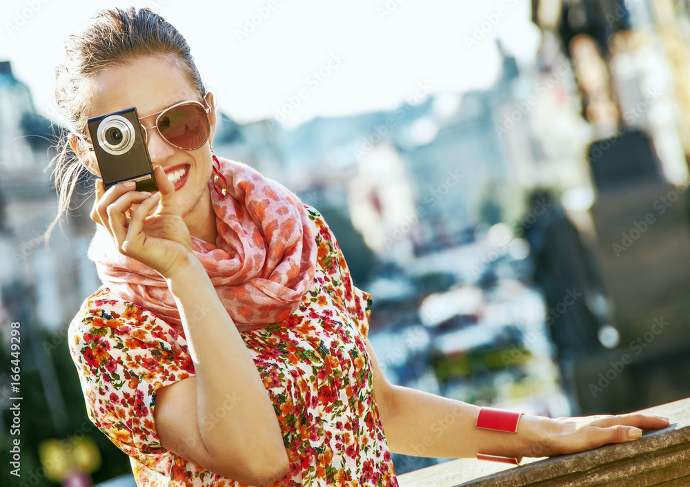 tourist woman with digital camera taking photo in Prague tourist woman with digital camera taking photo in Prague
