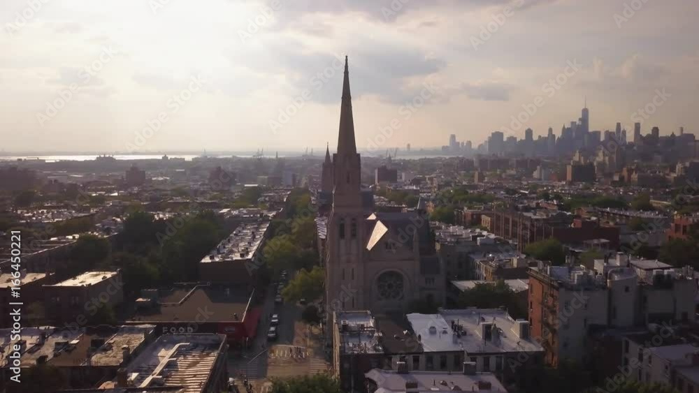 day orbiting clockwise around church in Park Slope Brooklyn revealing Manhattan skyline day orbiting clockwise around church in Park Slope Brooklyn revealing Manhattan skyline
