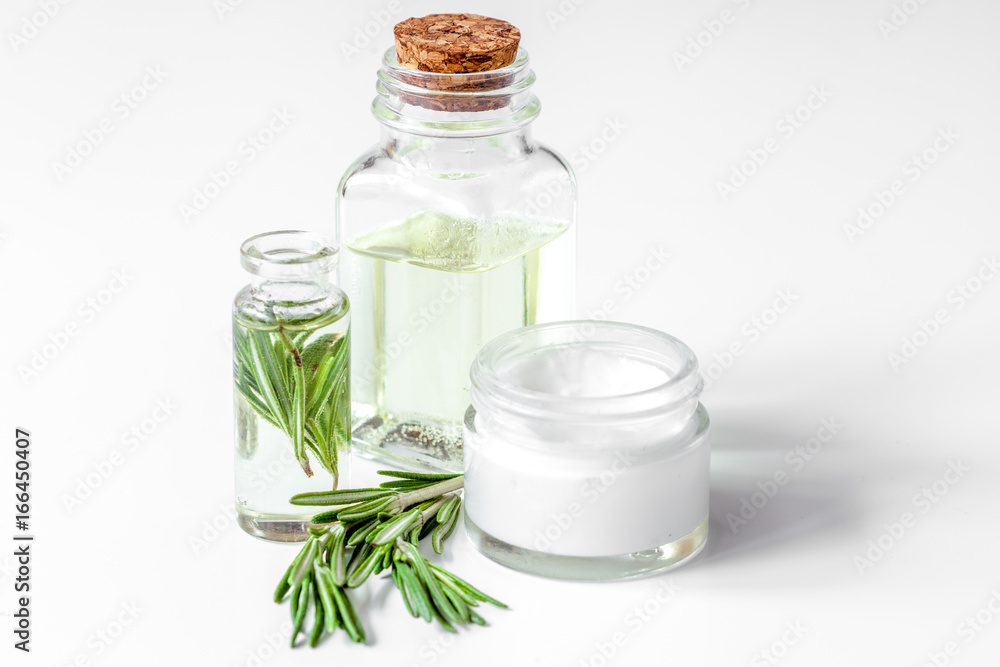 organic cosmetics with extracts of herbs rosemary on white backg organic cosmetics with extracts of herbs rosemary on white backg
