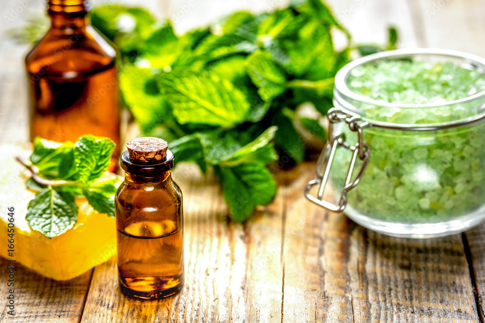 organic cosmetics with herbal extracts of mint on wooden backgro organic cosmetics with herbal extracts of mint on wooden backgro