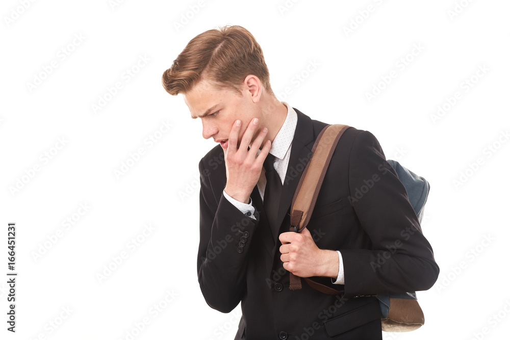 Studio portrait of teenage college student in black suit posing against white background Studio portrait of teenage college student in black suit posing against white background