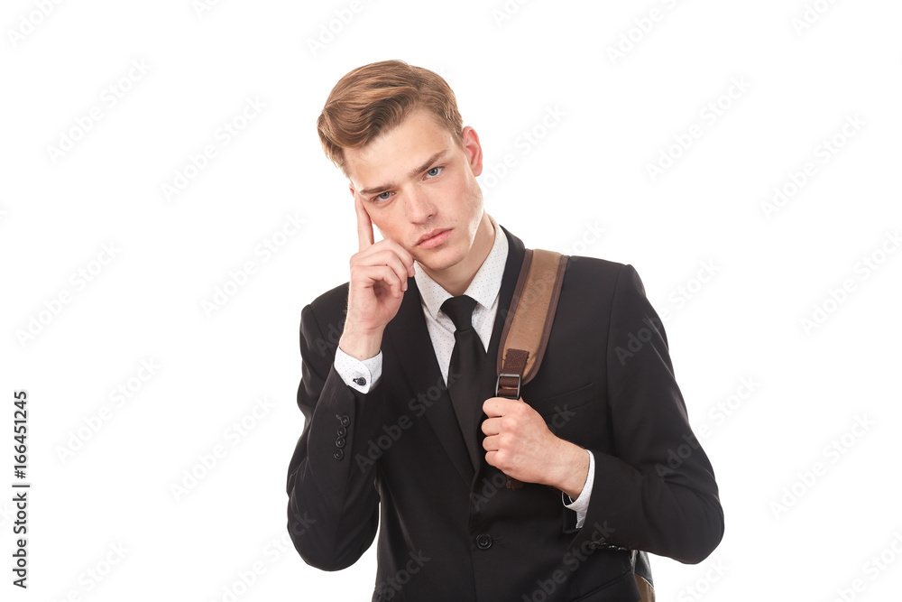 Studio portrait of teenage college student in black suit posing against white background Studio portrait of teenage college student in black suit posing against white background