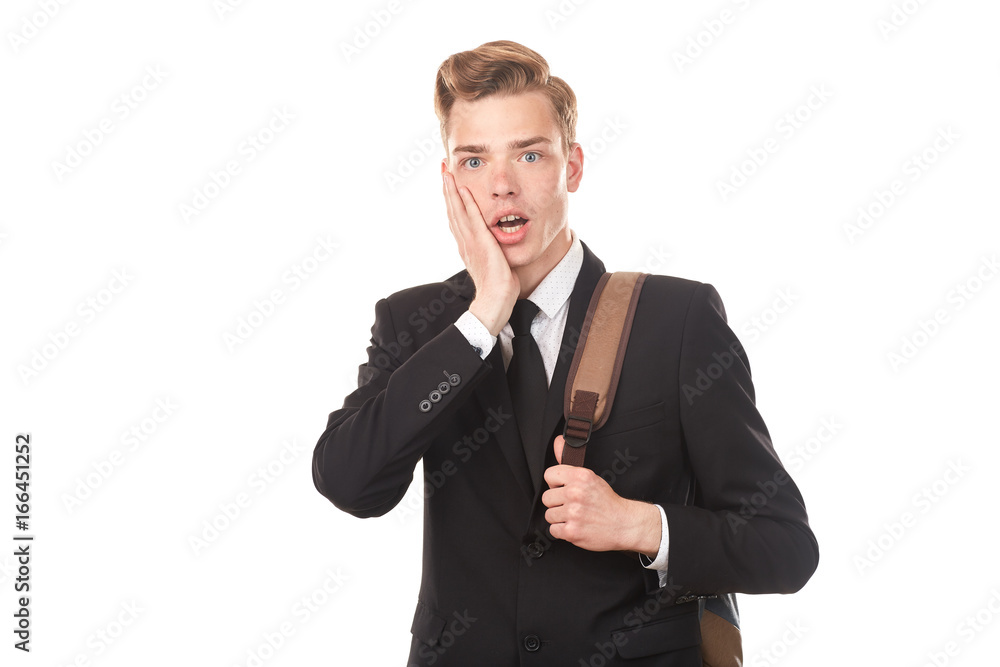 Studio portrait of teenage college student in black suit posing against white background Studio portrait of teenage college student in black suit posing against white background