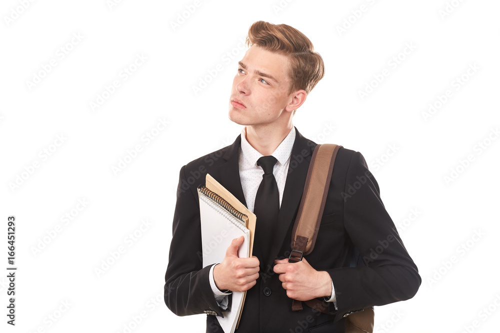 Studio portrait of teenage college student in black suit posing against white background Studio portrait of teenage college student in black suit posing against white background
