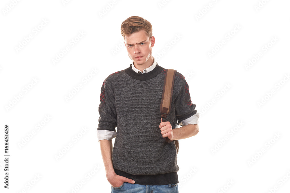 Studio portrait of handsome college boy in casual clothing with backpack Studio portrait of handsome college boy in casual clothing with backpack