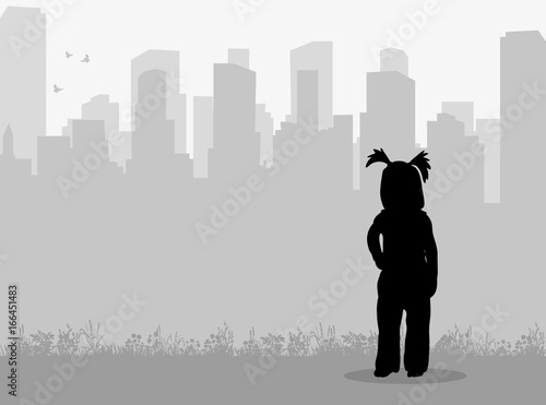 silhouette of a child on a city background