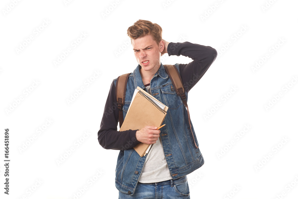 Portrait of schoolboy posing with notepads against white background Portrait of schoolboy posing with notepads against white background