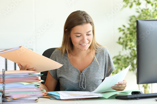Employee managing documents at office