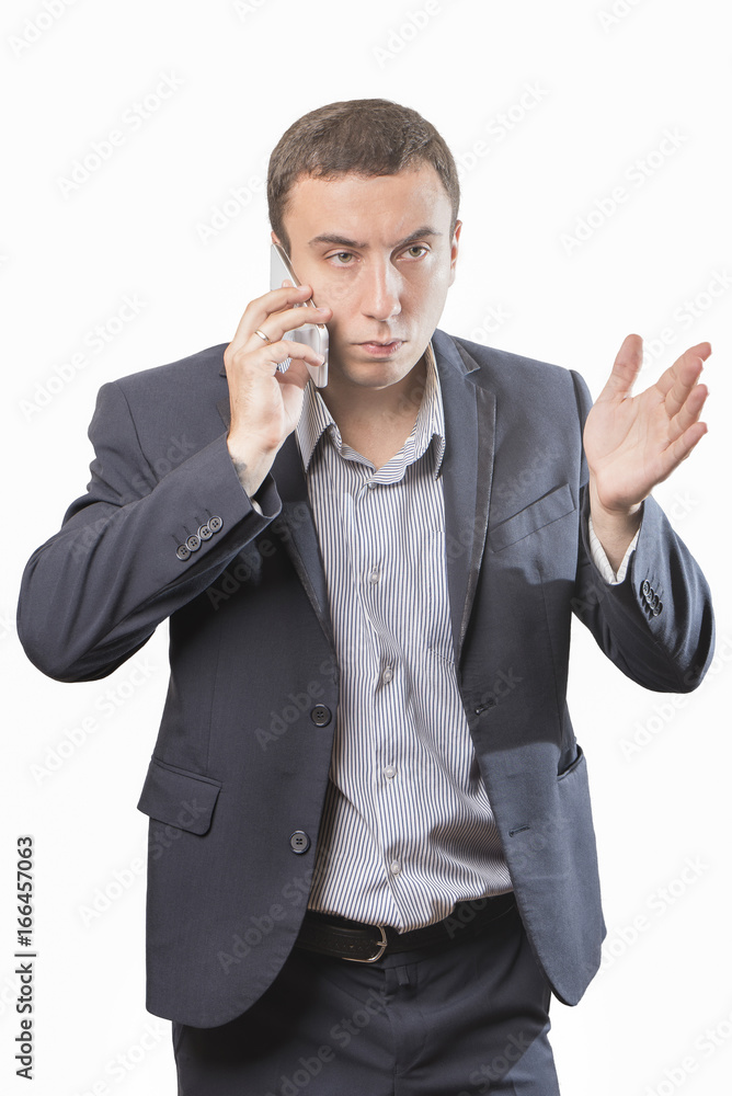 Angry businessman talking on the phone, Isolated on white background Angry businessman talking on the phone, Isolated on white background