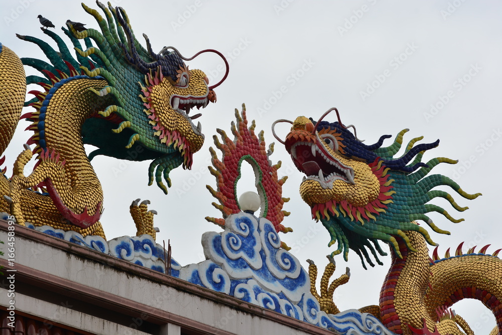 Two Chinese dragons at a temple in Thailand Two Chinese dragons at a temple in Thailand
