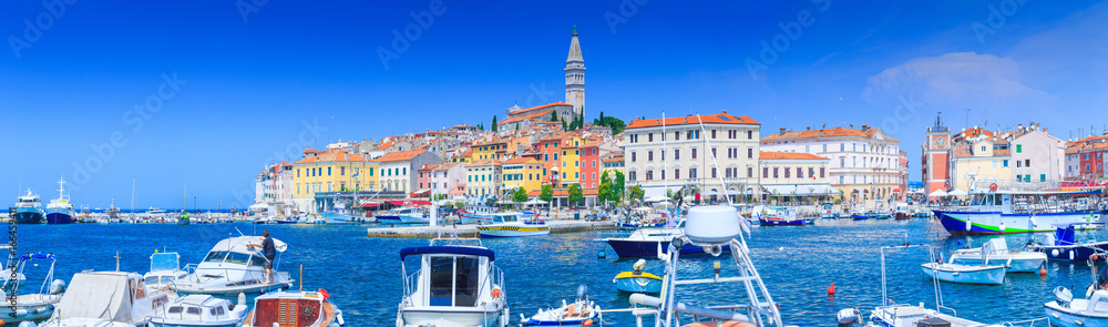 Fototapeta premium Wonderful romantic old town at Adriatic sea. Boats and yachts in harbor at magical summer. Rovinj. Istria. Croatia. Europe.