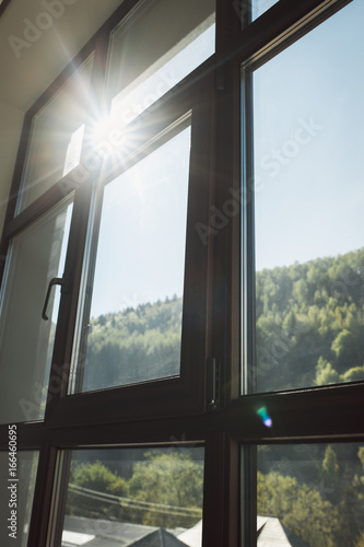 Morning in the mountains. Sun shines through the window