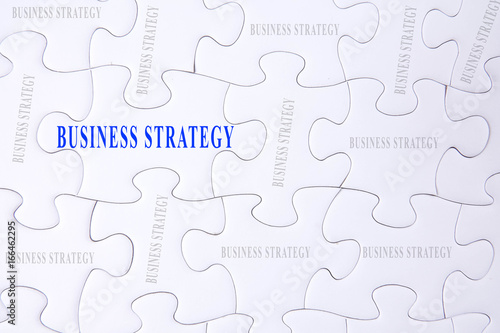 Jigsaw puzzle with BUSINESS STRATEGY words.