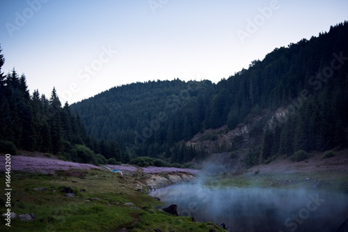 Landscape with mountain lake early in the morning