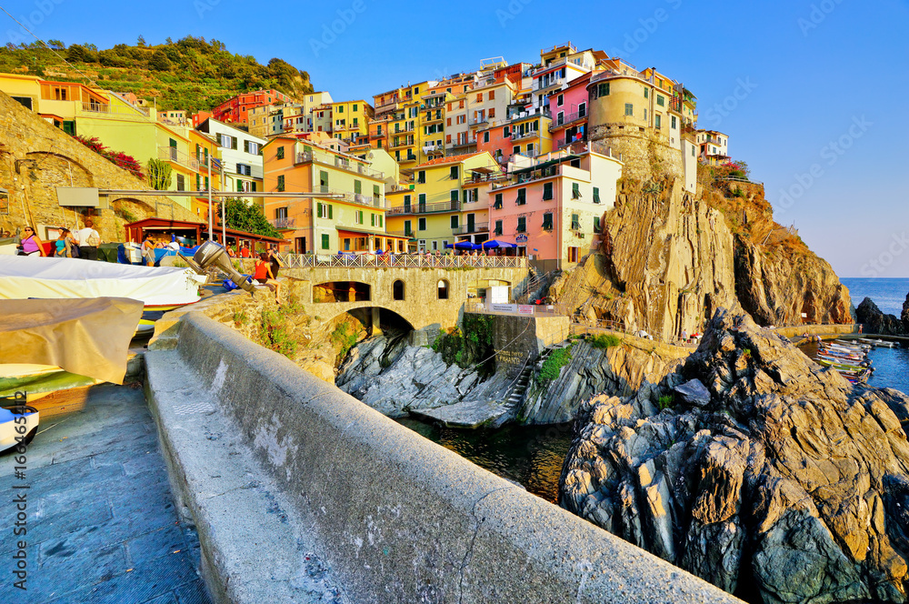 View of the colorful houses at sunset in Manarola, Italy