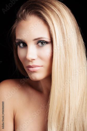 beautiful young blonde green eyes woman with long straith healthy hair