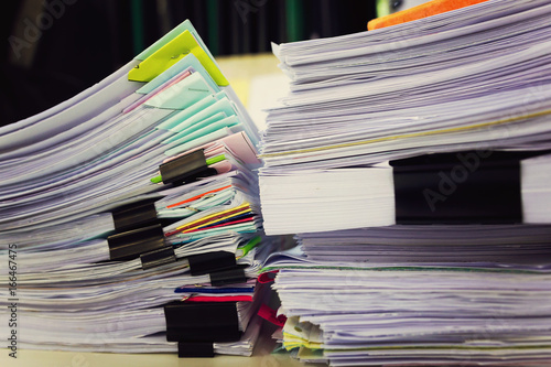 Pile of unfinished a bundle documents on office desk, Stack of business paper © iamaea