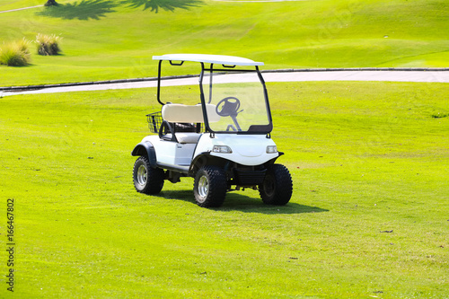 White golf cart in a golf course in the Thailand