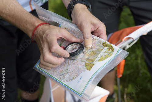Compass and map for orienteering photo