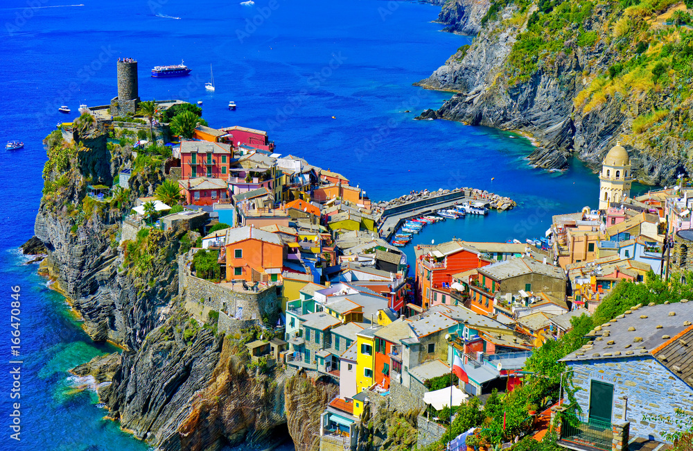 View of the colorful houses along the coastline of Cinque Terre area in Vernazza, Italy.