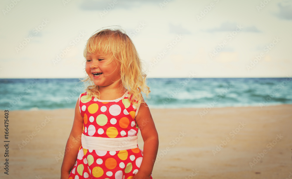 happy little girl play on beach happy little girl play on beach