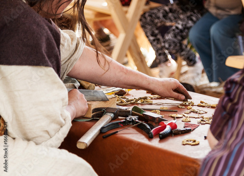 Female jeweler working with different tools, selective focus