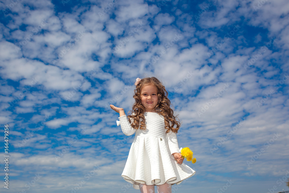 little girl in the clouds. little girl walks among the clouds. dreamy and fantasy concept little girl in the clouds. little girl walks among the clouds. dreamy and fantasy concept