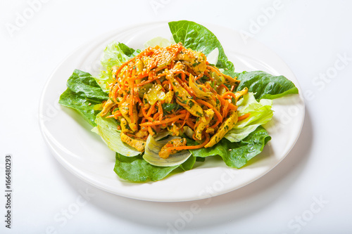 chicken salad with fresh vegetables and sesame in Asian style
