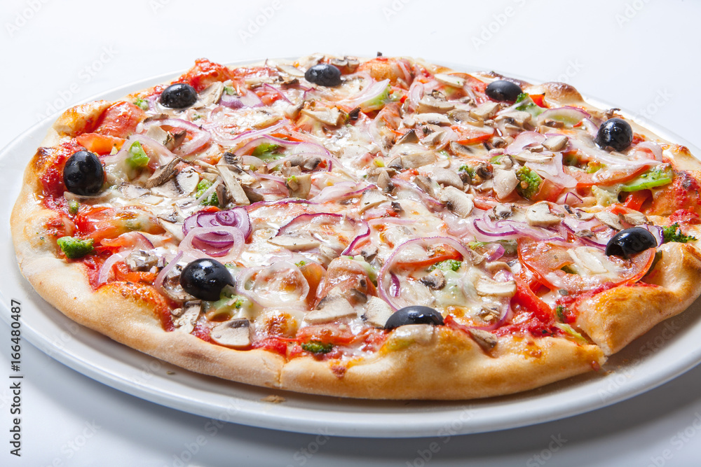 Pizza with onion and ham, cheese and tomato. White background