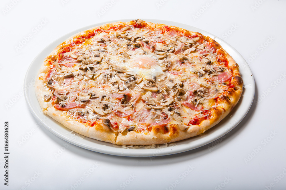 Italy pizza with egg yolk ham mushrooms on a white background