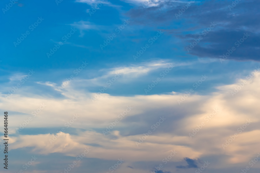 The blue backdrop has some clouds. The blue backdrop has some clouds.