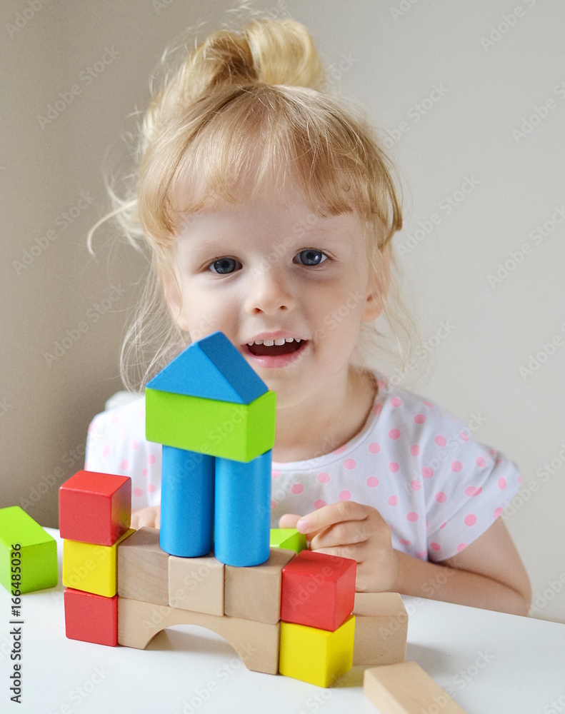 Caucasian Girl Playing with Wooden Colorful Cubes at Home Early Education Preparing for School Development Caucasian Girl Playing with Wooden Colorful Cubes at Home Early Education Preparing for School Development