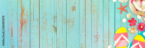 summer holiday - different beach accessoiries on a blue wood wall photo