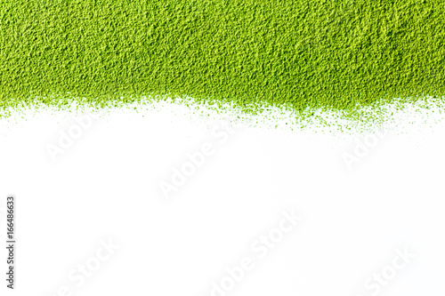 powdered green matcha tea on white background