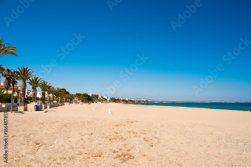 Sandy beach in L'Hospitalet de l'Infant, Tarragona, Catalunya, Spain. Copy space for text. © ggfoto