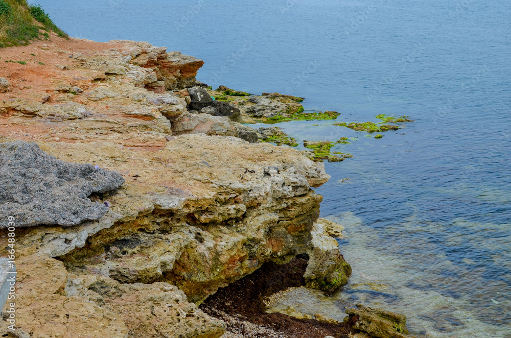 Steep, sharp, stone beaches on the Black Sea coast, in the vicinity of the city of Sevastopol of the Republic of Crimea, 2017